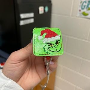 Grinch badge reel